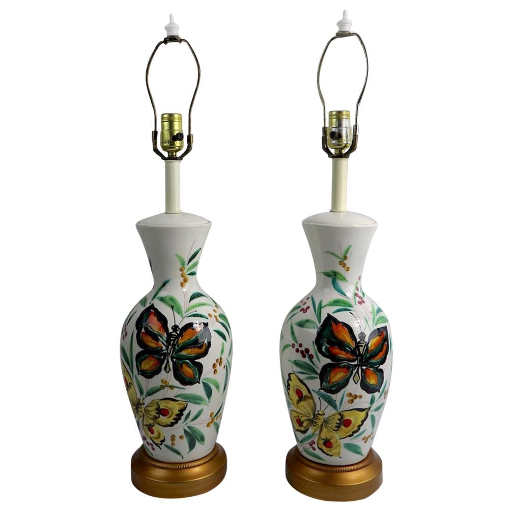 Chic Italian Porcelain Table Lamps Pair with Hand-Painted Butterflies: Chic Italian Porcelain Table Lamps Pair with Hand-Painted Butterflies This charming pair of porcelain table lamps features a classic late midcentury design, showcasing white bodies adorned with beauti