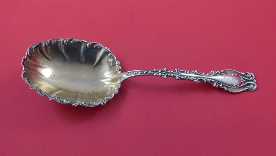 Frank Whiting Josephine sterling silver berry spoon gold washed 8 1/2": Frank Whiting Josephine sterling silver berry spoon gold washed 8 1/2" Sterling silver berry spoon in the Josephine pattern by Frank Whiting, featuring a gold washed fluted bowl and an ornate handle. 