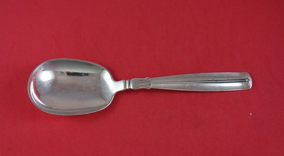 W&S Sorensen Lotus Sterling Silver Preserve Spoon 7 Inch Serving: W&S Sorensen Lotus Sterling Silver Preserve Spoon 7 Inch Serving Introducing the Lotus Preserve Spoon by W&S Sorensen, crafted from high-quality sterling silver. This elegant 7-inch serving spoon feat