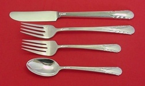 International Silver Orchid 4pc Sterling Silver Grille Place Setting: International Silver Orchid 4pc Sterling Silver Grille Place Setting Elevate your dining experience with the Orchid pattern by International Sterling. This elegant 4-piece grille size place setting is