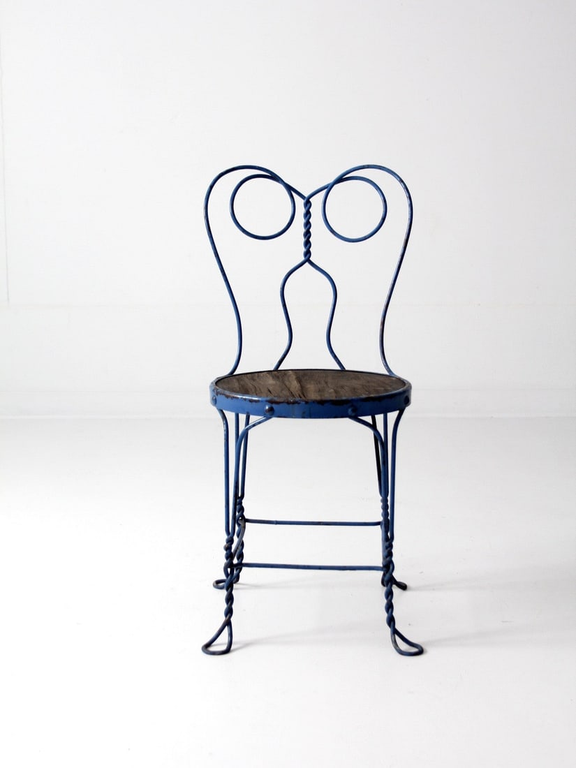 Blue Painted Metal Ice Cream Parlor Chair with Wood Seat: Blue Painted Metal Ice Cream Parlor Chair with Wood Seat Early 20th century ice cream parlor chair with a sculptural spectacle-form wire back, painted metal frame, and round wood seat. Twisted detaili