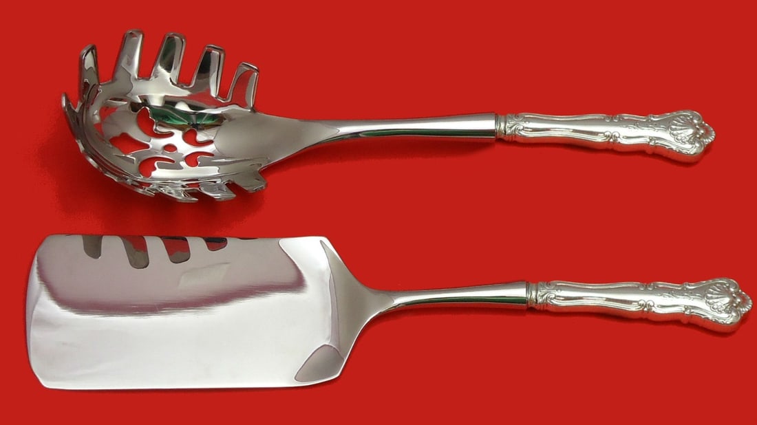 Durgin New Queens Sterling Silver 2pc Hostess Pasta Server Set: Durgin New Queens Sterling Silver 2pc Hostess Pasta Server Set Enhance your dining experience with this exquisite 2-piece Italian Pasta Server Set by Durgin, featuring the elegant New Queens pattern. 