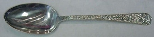 International Radiant Rose Sterling Silver Serving Spoon 8 1/8": International Radiant Rose Sterling Silver Serving Spoon 8 1/8" Sterling silver serving spoon in the Radiant Rose pattern by International. This pre-owned piece features an ornate handle design, is no