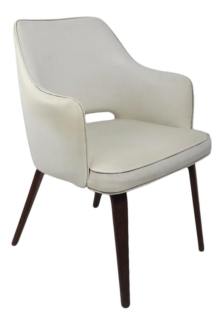 Brody Mid Century Lounge Armchair in White Vinyl Thonet Style: Brody Mid Century Lounge Armchair in White Vinyl Thonet Style This stylish Mid Century Lounge Armchair, inspired by Thonet, features a sleek design with white vinyl upholstery and elegantly bent plywo