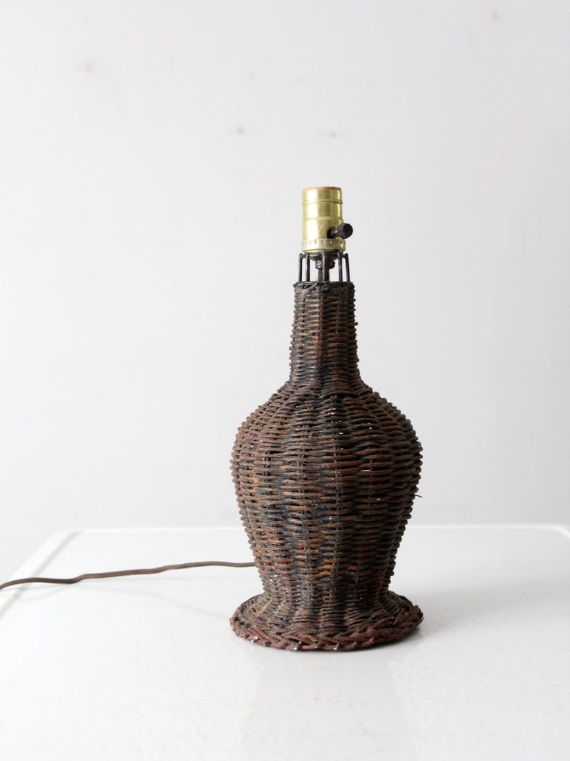 Handwoven Wicker Rustic Table Lamp 14 inch: Handwoven Wicker Rustic Table Lamp 14 inch This handwoven vintage wicker table lamp features a classic shape that brings a touch of rustic elegance to any space. It is in good condition, exhibiting we