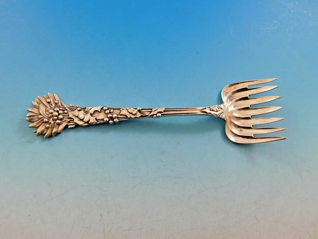 Tiffany & Co. Holly Sterling Silver Hors D'Oeuvre Fork 5 1/4": Tiffany & Co. Holly Sterling Silver Hors D'Oeuvre Fork 5 1/4" This exquisite hors d'oeuvre fork from Tiffany & Co.'s Holly pattern is crafted from high-quality sterling silver. Measuring 5 1/4" in len
