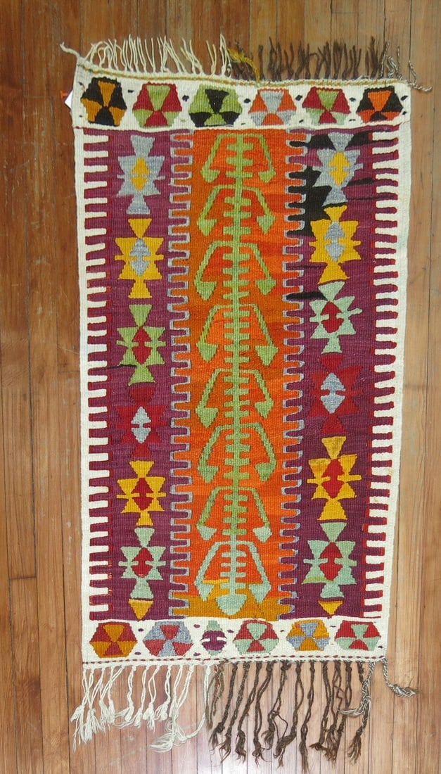 2' 4" x 3' 7" Small Turkish Kilim Rug: 2' 4" x 3' 7" Small Turkish Kilim Rug 20th century Turkish kilim in a scatter size. This pre-owned small kilim is identified as a kilim and offers a versatile format for a variety of interior settings