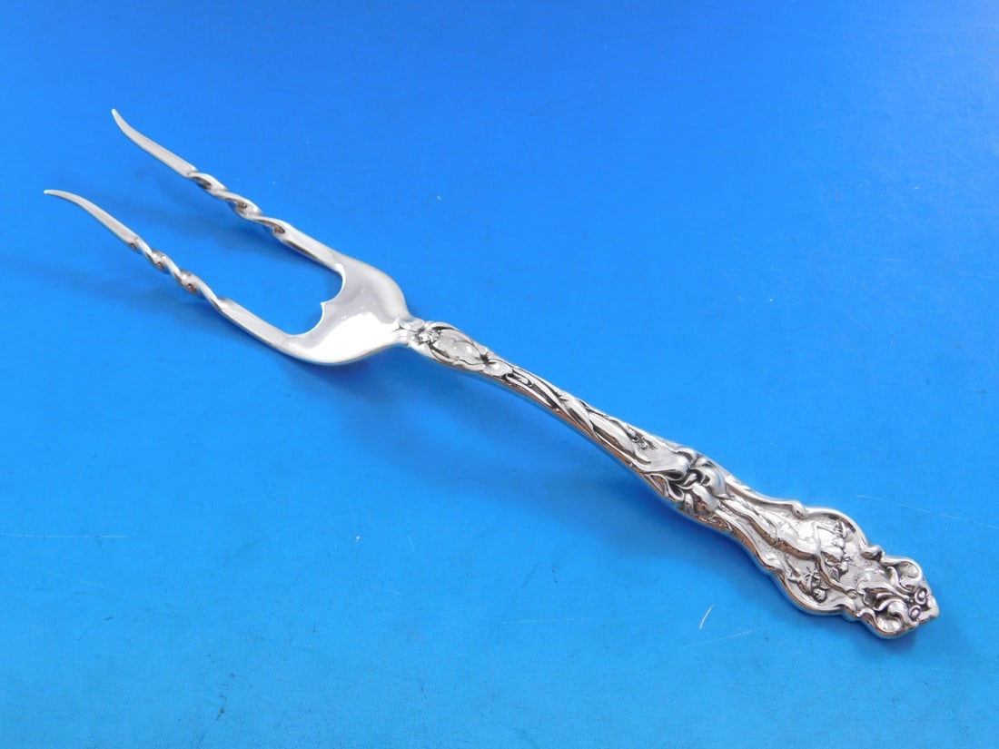Wallace Irian Sterling Silver Figural Baked Potato Fork 7 1/8": Wallace Irian Sterling Silver Figural Baked Potato Fork 7 1/8" Introducing the Irian by Wallace Sterling Silver Baked Potato Fork, a beautiful serving piece crafted in the elegant Art Nouveau style. T