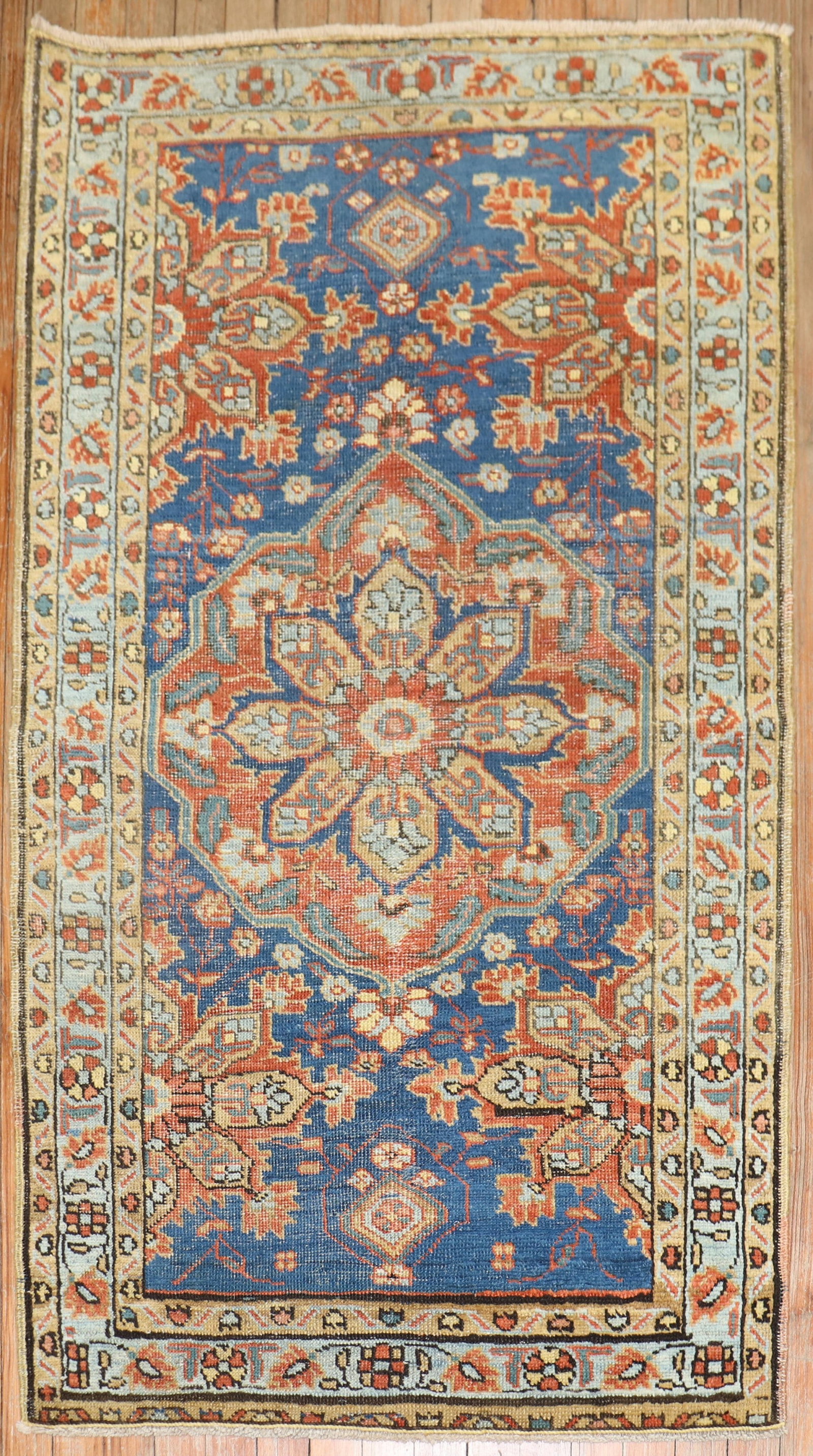 2' 10" x 4' 11" Early 20th Century Persian Serapi Heriz Rug: 2' 10" x 4' 11" Early 20th Century Persian Serapi Heriz Rug Early 20th century Persian Heriz rug with a blue field and intricate floral and geometric patterning. This pre-owned small rug is described 
