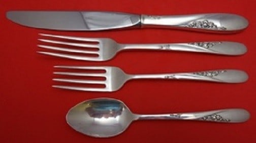 Easterling Rose Sterling Silver 4-Piece Place Setting: Easterling Rose Sterling Silver 4-Piece Place Setting Enhance your dining experience with this exquisite 4-piece place setting in the charming Rose pattern by Easterling. Crafted from high-quality ste
