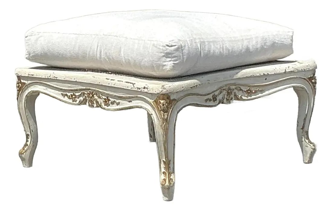 Vintage Regency Cane Ottoman with Carved Gold Finish: Vintage Regency Cane Ottoman with Carved Gold Finish Elevate your home decor with this vintage Regency cane ottoman, a stunning embodiment of timeless elegance. This piece features an intricately carv