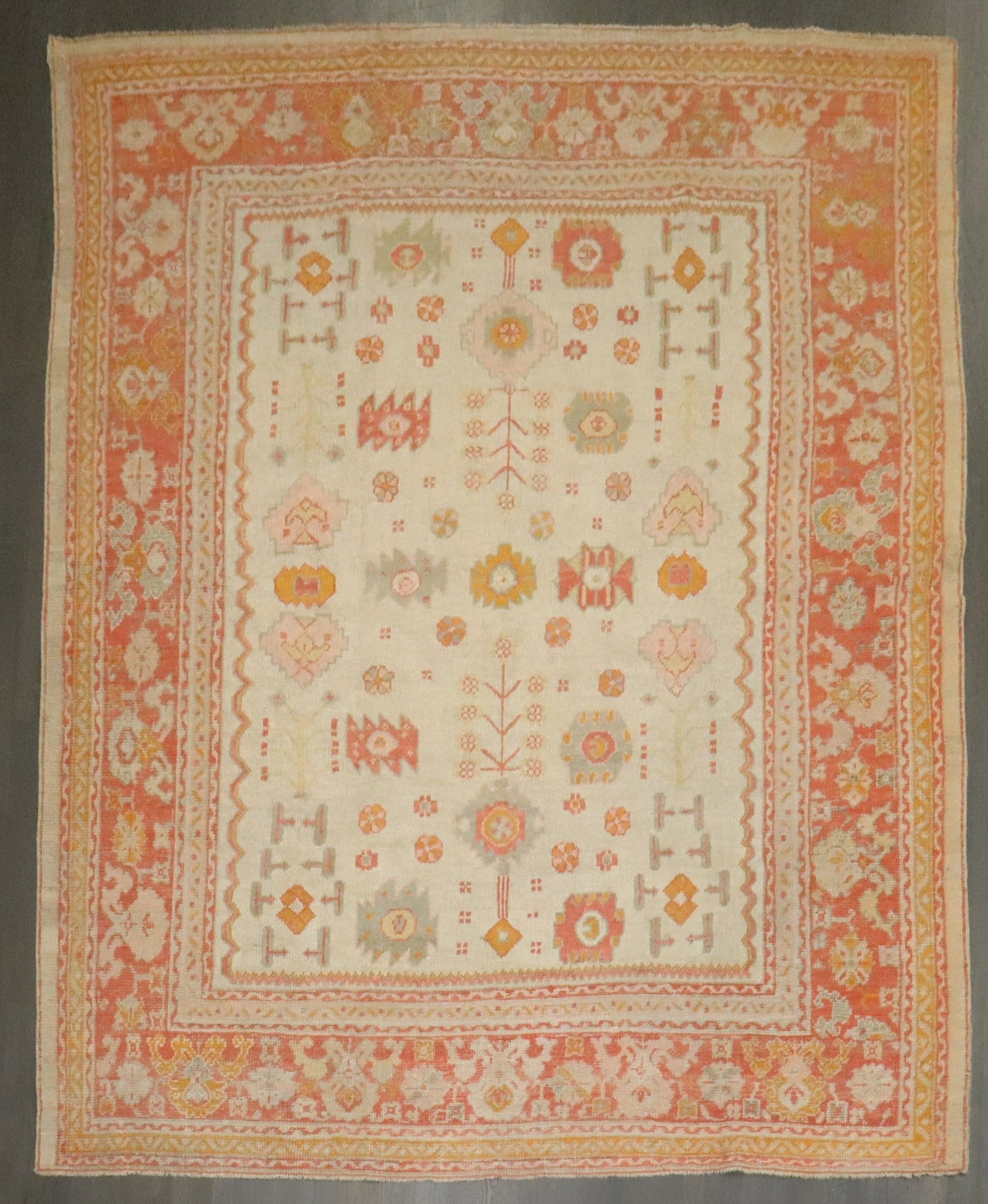 8' 8" x 10' 8" Antique Turkish Oushak Room Carpet Ivory Field: 8' 8" x 10' 8" Antique Turkish Oushak Room Carpet Ivory Field Early 20th century antique Turkish Oushak carpet with an ivory field, suited for room-size use. This pre-owned rug is identified as an Ous