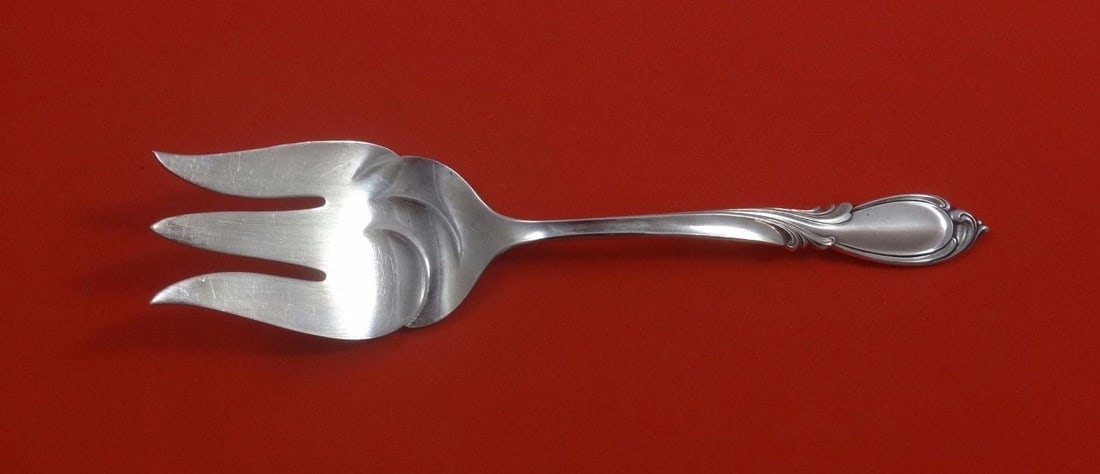 International Sterling Silver Rhapsody New Salad Serving Fork 9 inch 3-Tine: International Sterling Silver Rhapsody New Salad Serving Fork 9 inch 3-Tine Introducing the Rhapsody New Salad Serving Fork, crafted from high-quality sterling silver by International. This exquisite 