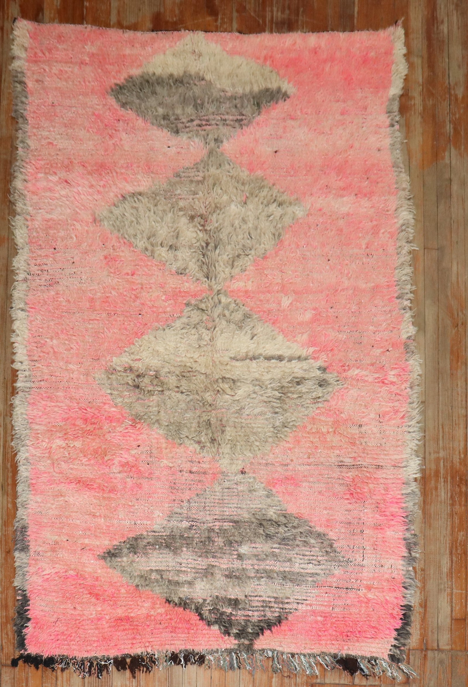 5' 4" x 8' 9" Moroccan Rug in Pink and Brown: 5' 4" x 8' 9" Moroccan Rug in Pink and Brown Antique Moroccan rug in pink and brown tones. This pre-owned piece offers a classic Moroccan look with a warm, muted palette. Specifications Type: Moroccan