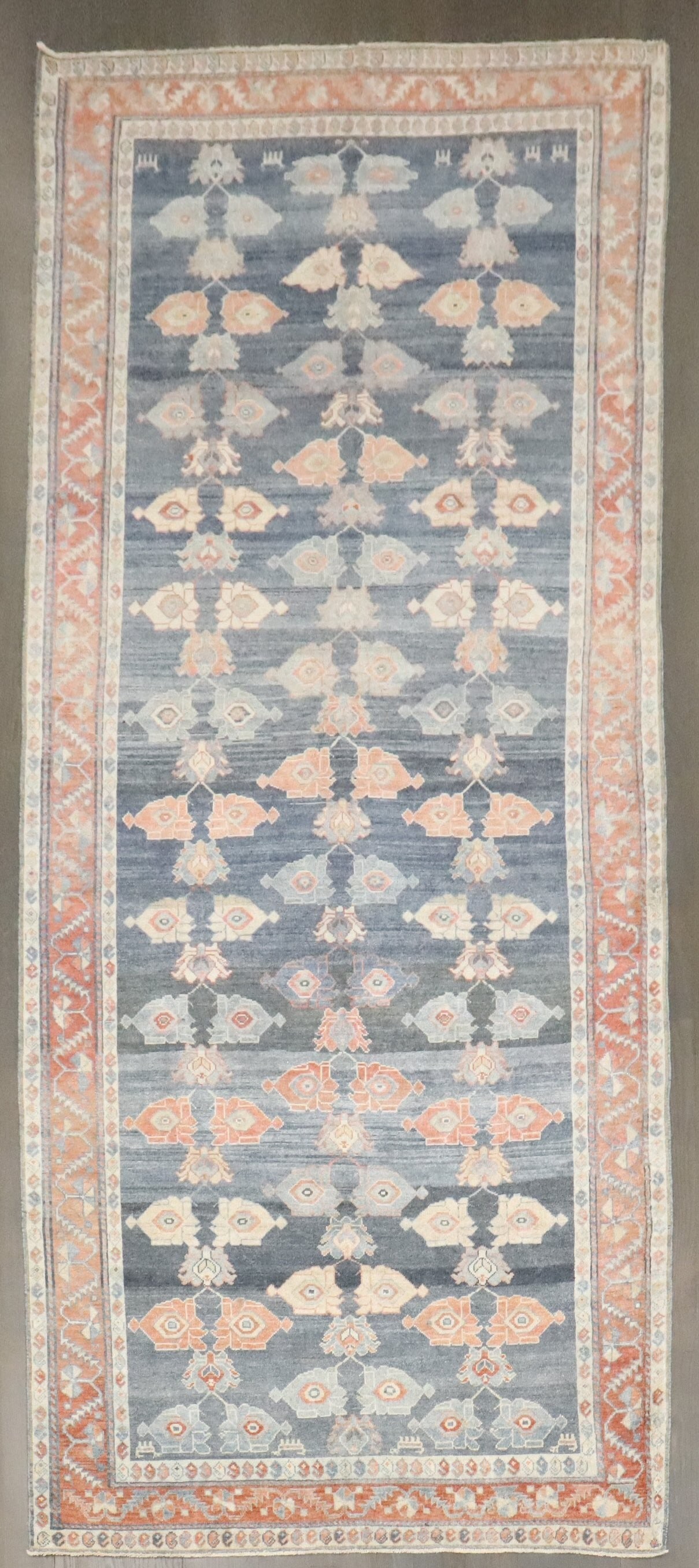 4' 9" x 10' 8" Wide N.W. Persian Runner Rug 1920s: 4' 9" x 10' 8" Wide N.W. Persian Runner Rug 1920s A 1920s Northwest Persian gallery runner with a wide format. This pre-owned rug is identified as N.W. Persian and categorized as a gallery runner. Spe
