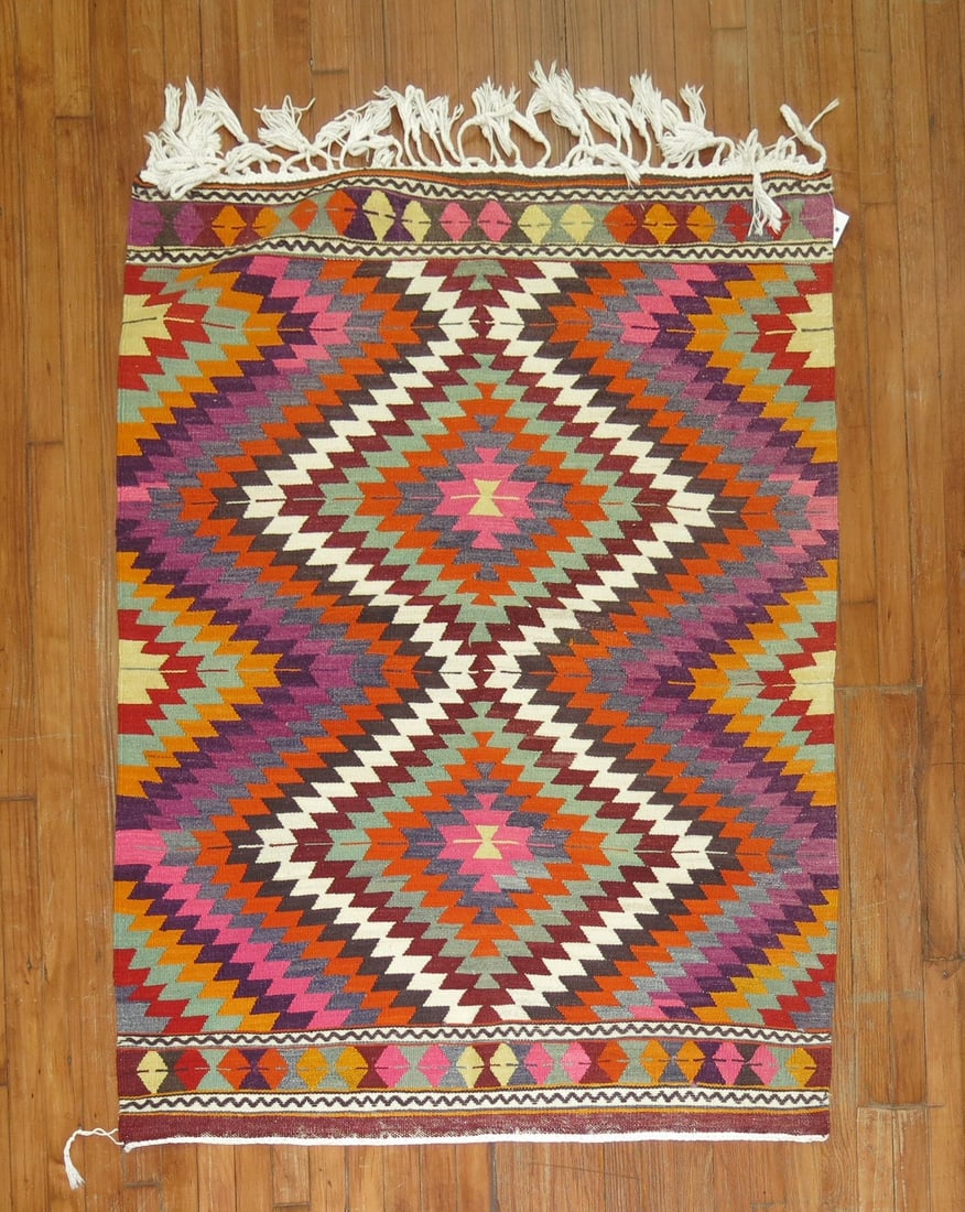 3' 9" x 4' 11" Mid 20th Century Turkish Kilim Rug: 3' 9" x 4' 11" Mid 20th Century Turkish Kilim Rug Vintage Turkish kilim from the mid 20th century. This pre-owned small square rug features a colorful geometric design with diamond motifs and fringe a