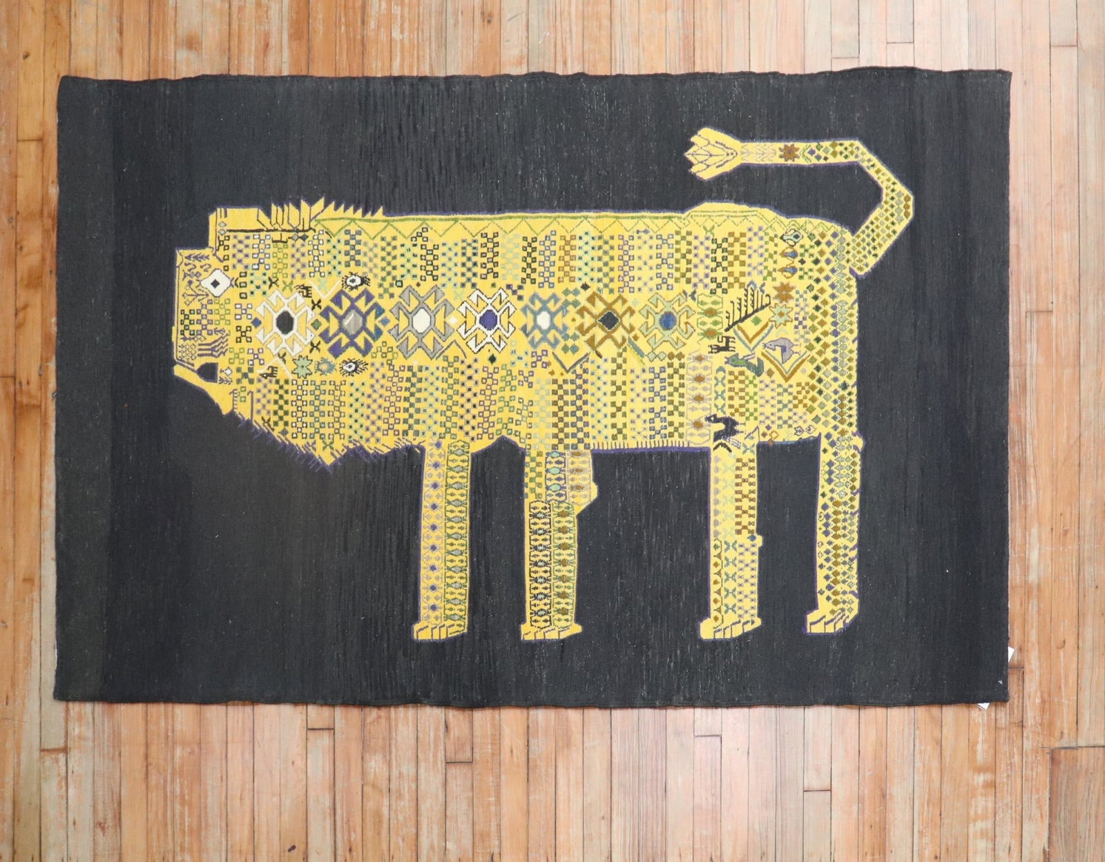 4' 2" x 6' 8" Persian Pictorial Kilim Rug Yellow Lion Design: 4' 2" x 6' 8" Persian Pictorial Kilim Rug Yellow Lion Design Late 20th century Persian kilim featuring a yellow lion with abstract elements and a gorilla face set against a black ground. This accent-s