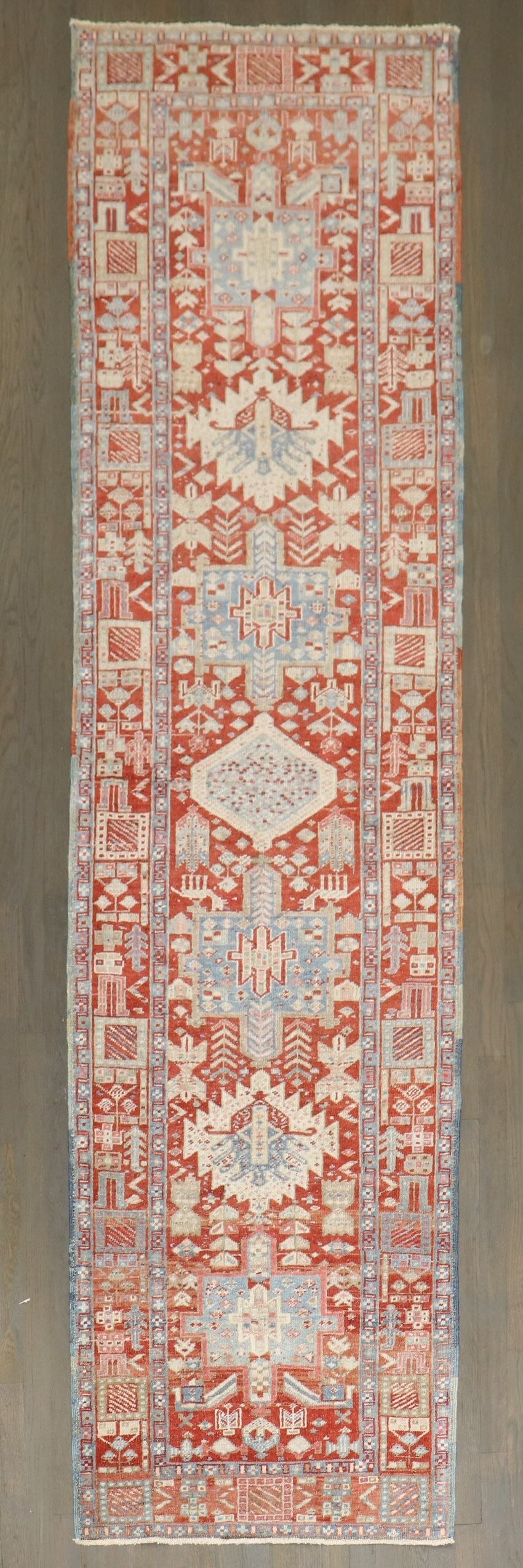 2' 9" x 10' 2" Persian Heriz Karadja Runner: 2' 9" x 10' 2" Persian Heriz Karadja Runner Early 20th-century Persian Heriz Karadja runner in a red and icy blue palette. Classified as a Serapi/Heriz runner, this pre-owned piece offers the distinct
