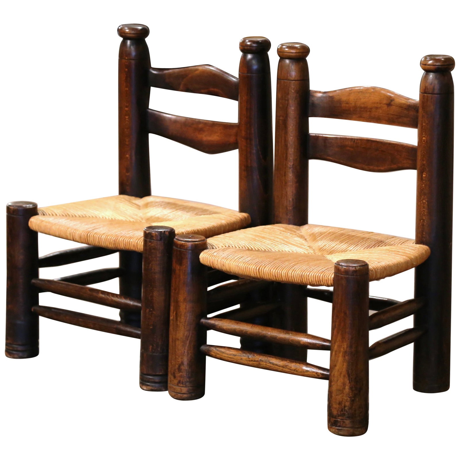 Set of 2 Early 20th Century French Walnut Low Chairs by Charles Dudouyt: Set of 2 Early 20th Century French Walnut Low Chairs by Charles Dudouyt This exquisite pair of early 20th-century low chairs showcases the craftsmanship of Charles Dudouyt. Crafted in France circa 192