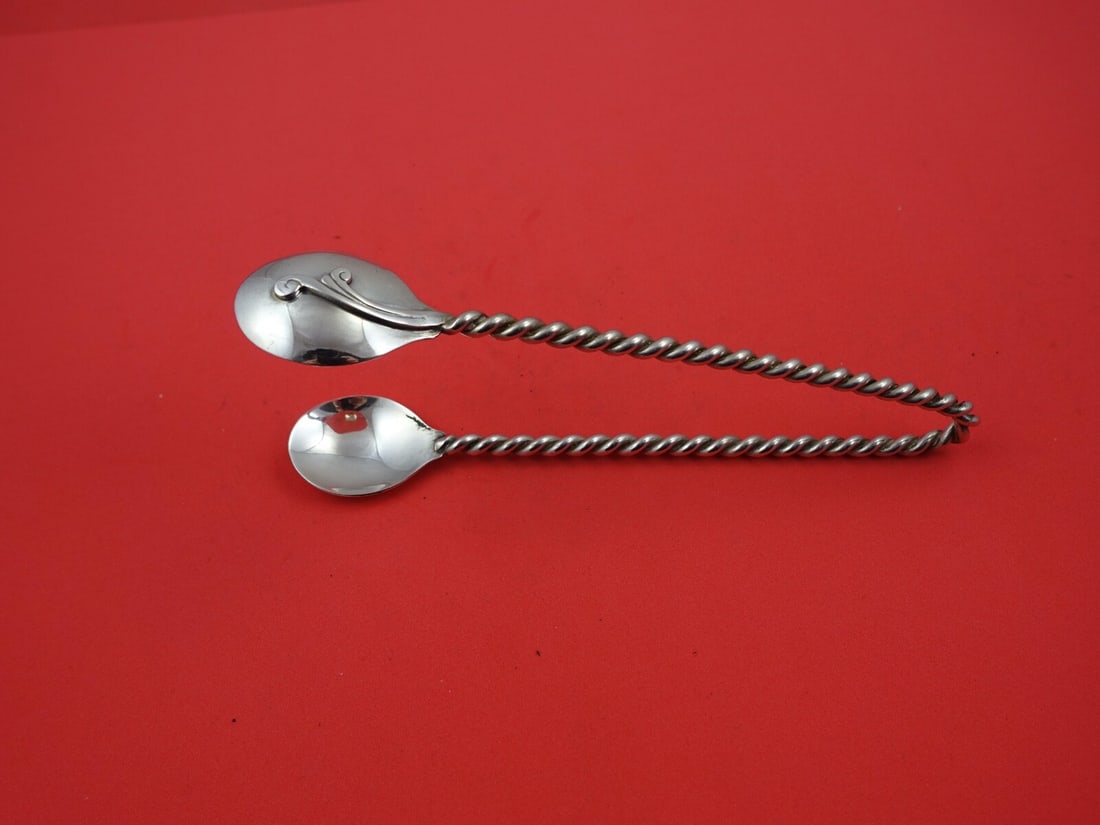 Sterling Silver Ice Tong Revere Pattern Hand Wrought 7.5 Inch: Sterling Silver Ice Tong Revere Pattern Hand Wrought 7.5 Inch This exquisite ice tong features the elegant Revere pattern and is crafted from high-quality sterling silver. It boasts a hand-wrought twi