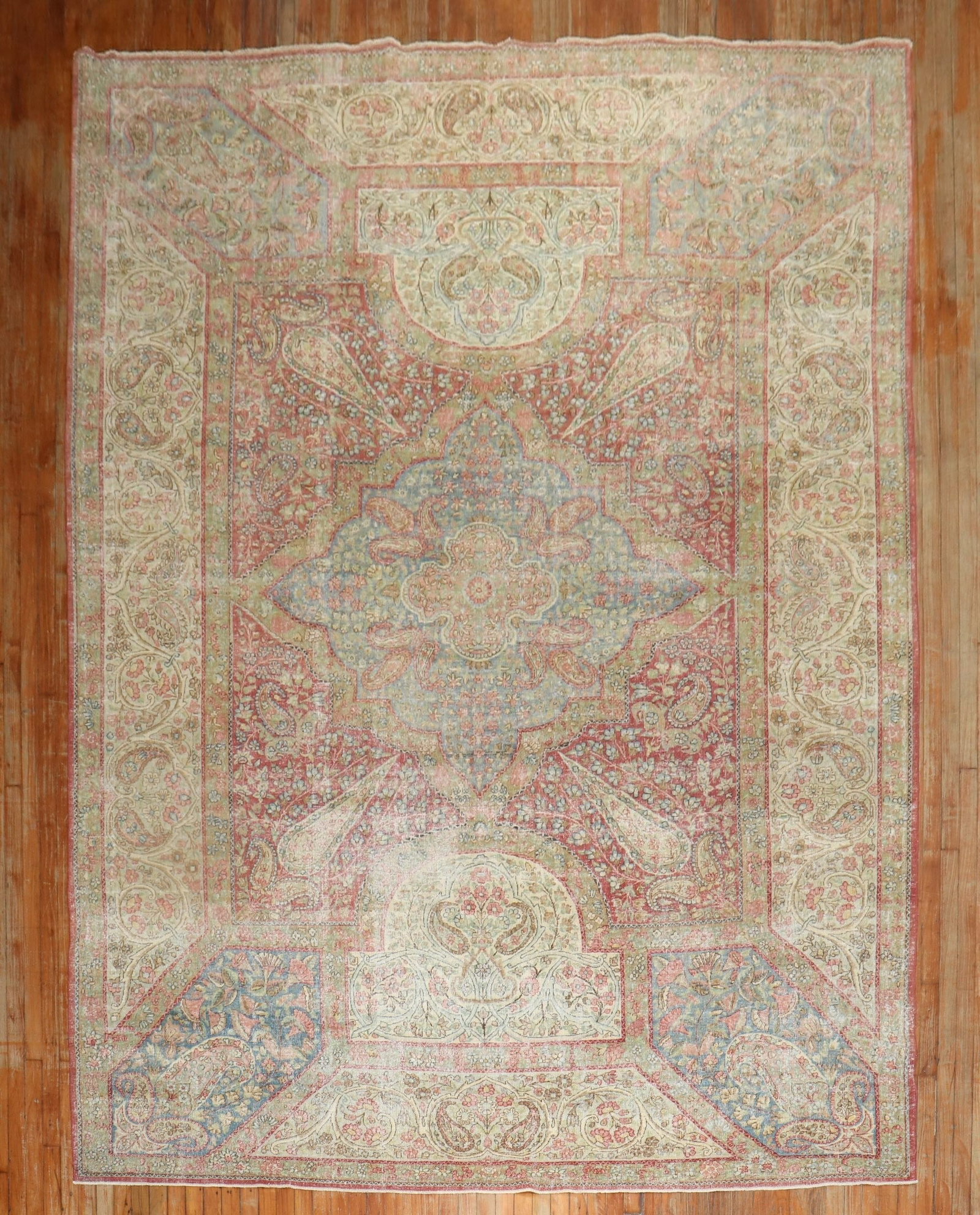 8' 10" x 13' 3" Persian Kerman Room Rug Floral Design: 8' 10" x 13' 3" Persian Kerman Room Rug Floral Design Early 20th century Persian Kerman rug featuring a botanical floral design and even wear throughout. This pre-owned room-size rug is described as K