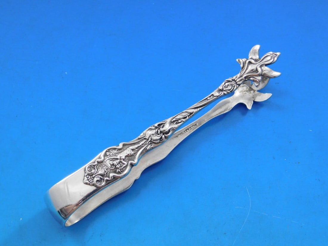 Wallace Irian Sterling Silver Large Sugar Tong 4.5 Inch Serving Piece: Wallace Irian Sterling Silver Large Sugar Tong 4.5 Inch Serving Piece Presenting the Irian pattern sugar tongs by Wallace, crafted from high-quality sterling silver. This elegant piece measures 4 1/2 
