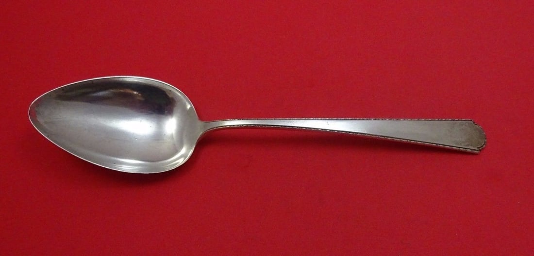 Weidlich Virginia Sterling Silver Serving Spoon 8 1/4": Weidlich Virginia Sterling Silver Serving Spoon 8 1/4" Experience the elegance of the Virginia Sterling pattern with this exquisite serving spoon by Weidlich. Crafted from high-quality sterling silver