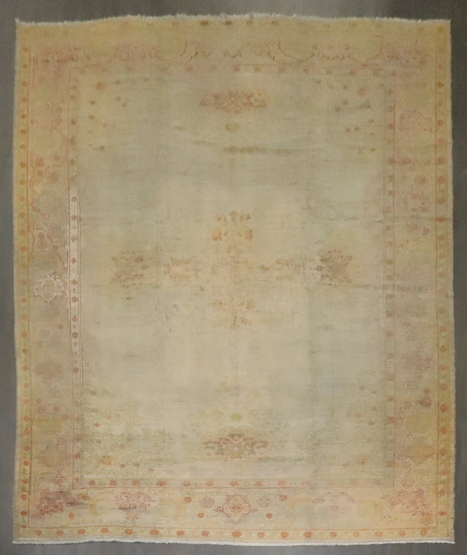 11' 3" x 15' Late 19th Century Turkish Oushak Carpet Gray Field: 11' 3" x 15' Late 19th Century Turkish Oushak Carpet Gray Field Late 19th century antique Turkish Oushak carpet with a gray field and a faded floral design. This pre-owned oversize room rug presents t
