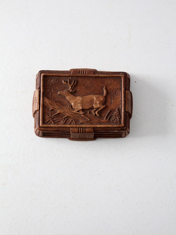 1940s Vintage Syroco Style Cigarette Box with Galloping Deer: 1940s Vintage Syroco Style Cigarette Box with Galloping Deer This vintage 1940s Syroco style cigarette box showcases a beautifully hand-carved appearance crafted from casted composite wood. Its design