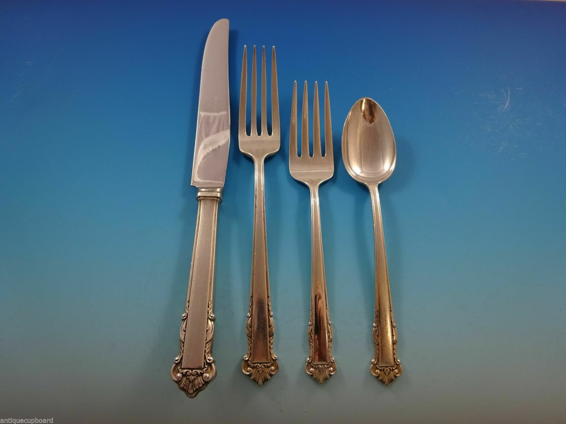 Lunt Sterling Silver English Shell 4-Piece Place Setting: Lunt Sterling Silver English Shell 4-Piece Place Setting Enhance your dining experience with this exquisite 4-piece place setting of the English Shell pattern by Lunt. Crafted from high-quality sterli