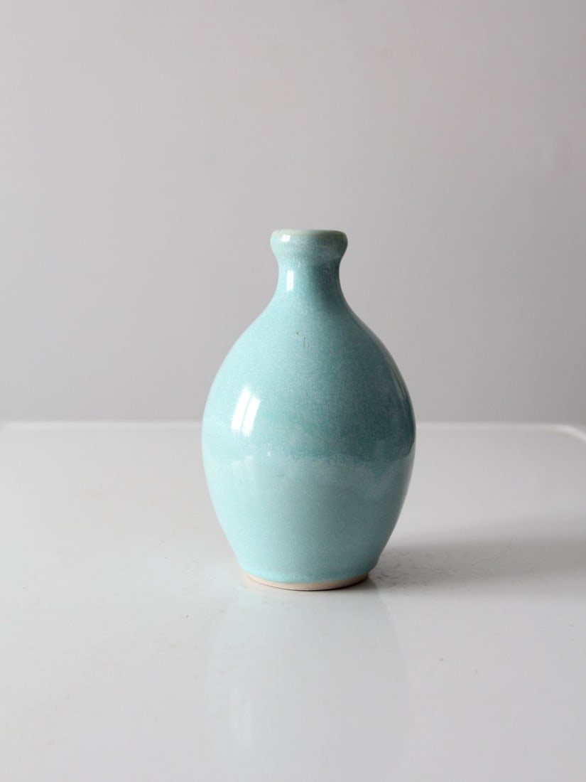 Signed Vintage Studio Pottery Bottleneck Vase Robin's Egg Blue: Signed Vintage Studio Pottery Bottleneck Vase Robin's Egg Blue This vintage studio pottery vase showcases a beautifully hand-crafted design with a distinctive bottle neck shape. Finished with a charmi