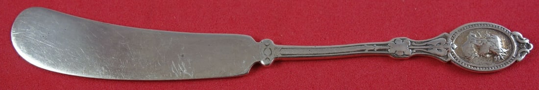Hotchkiss and Schreuder Medallion Sterling Silver Butter Spreader 5 1/4": Hotchkiss and Schreuder Medallion Sterling Silver Butter Spreader 5 1/4" This exquisite butter spreader from Hotchkiss and Schreuder features a stunning Medallion pattern, showcasing the elegance of