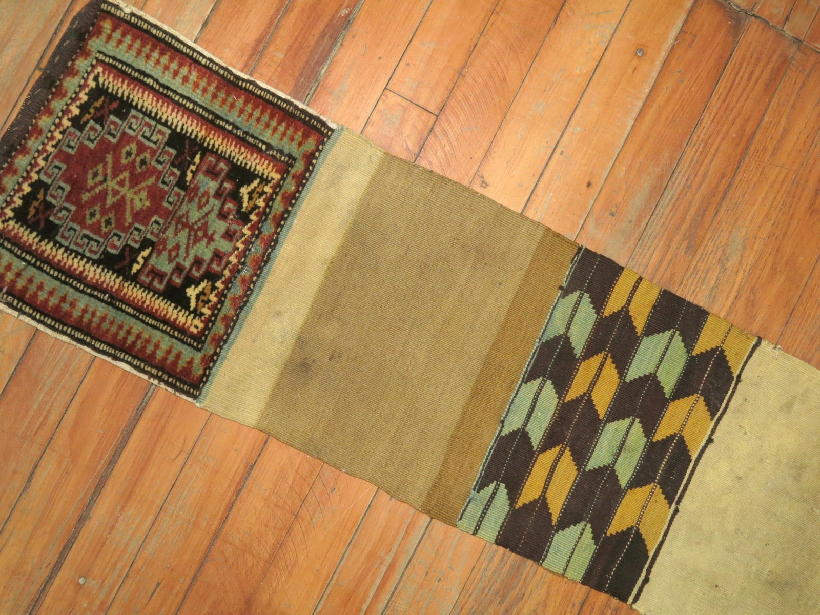 19th Century Kazak Bagface Tribal Textile Rug 1' x 4' 2": 19th Century Kazak Bagface Tribal Textile Rug 1' x 4' 2" A 19th century tribal Kazak bagface trapping textile rug with a small-format design. It is presented as a pre-owned piece. Specifications Item 