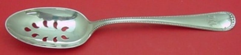 Gorham Newcastle Sterling Silver Slotted Serving Spoon 9-Hole 8 5/8": Gorham Newcastle Sterling Silver Slotted Serving Spoon 9-Hole 8 5/8" This Newcastle pattern serving spoon by Gorham is a stunning example of fine craftsmanship. Crafted from sterling silver, this slot