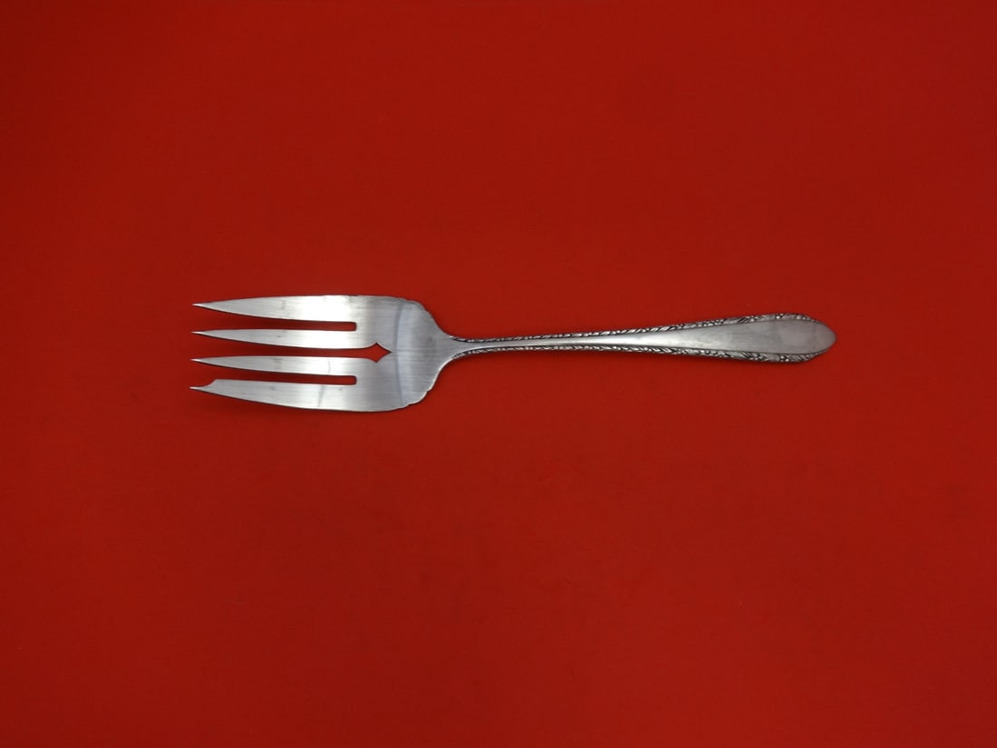 Royal Crest Wild Flower sterling silver serving cold meat fork 8 1/8": Royal Crest Wild Flower sterling silver serving cold meat fork 8 1/8" Sterling silver cold meat fork in the Wild Flower pattern by Royal Crest. The piece measures 8 1/8 inches and is not monogrammed. 