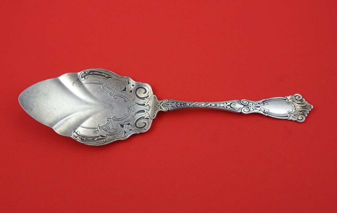 Wallace Berain Sterling Silver Decorative Pie Server 9 3/4": Wallace Berain Sterling Silver Decorative Pie Server 9 3/4" This exquisite pie server from the Berain pattern by Wallace is crafted from high-quality sterling silver. Featuring a decorative blade and 
