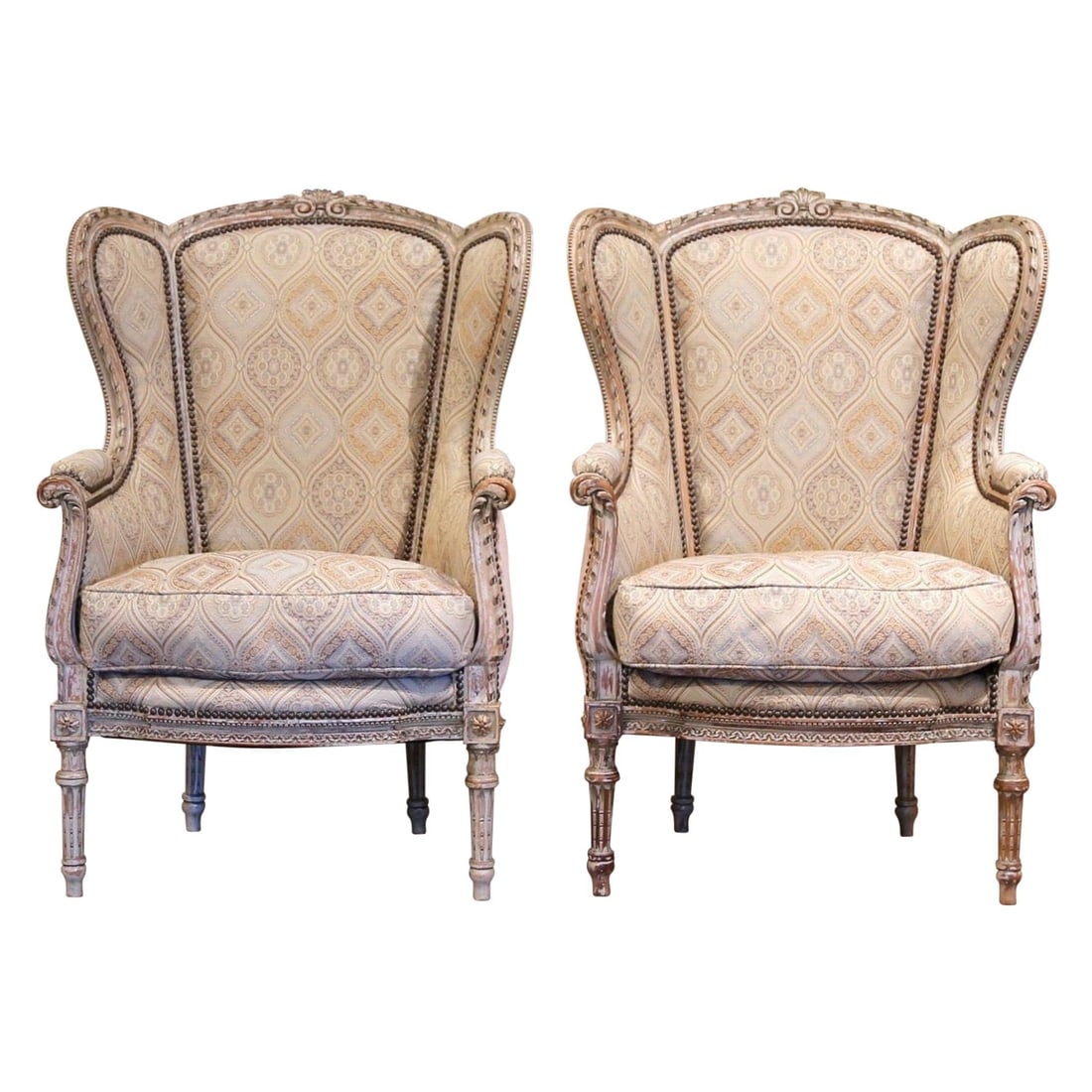 Set of 2 19th Century Louis XVI Wingback Armchairs in Geometric Fabric: Set of 2 19th Century Louis XVI Wingback Armchairs in Geometric Fabric Elevate your living space with this exquisite pair of 19th-century French Louis XVI painted bergeres. Crafted circa 1870, these e