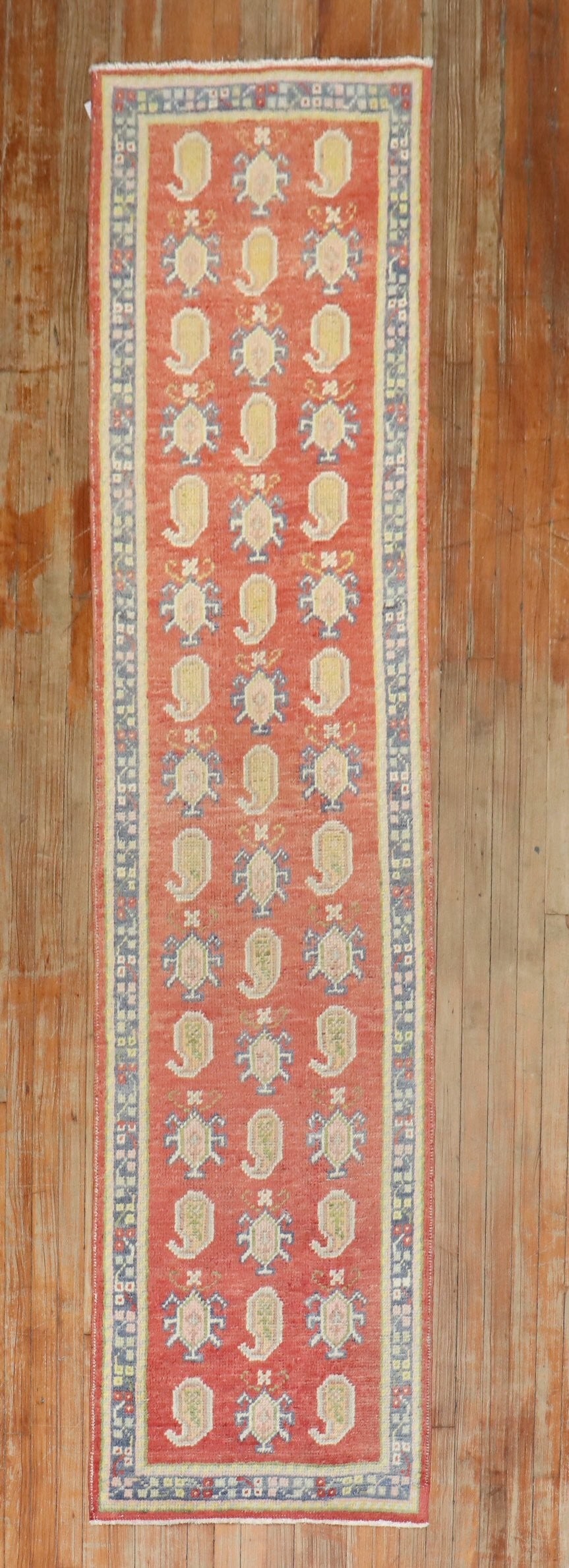 2' 5" x 10' 1" Mid Century Turkish Oushak Runner: 2' 5" x 10' 1" Mid Century Turkish Oushak Runner Vintage Turkish Oushak runner featuring an all-over paisley design on a red field. This mid-20th century piece is offered in pre-owned condition. Speci