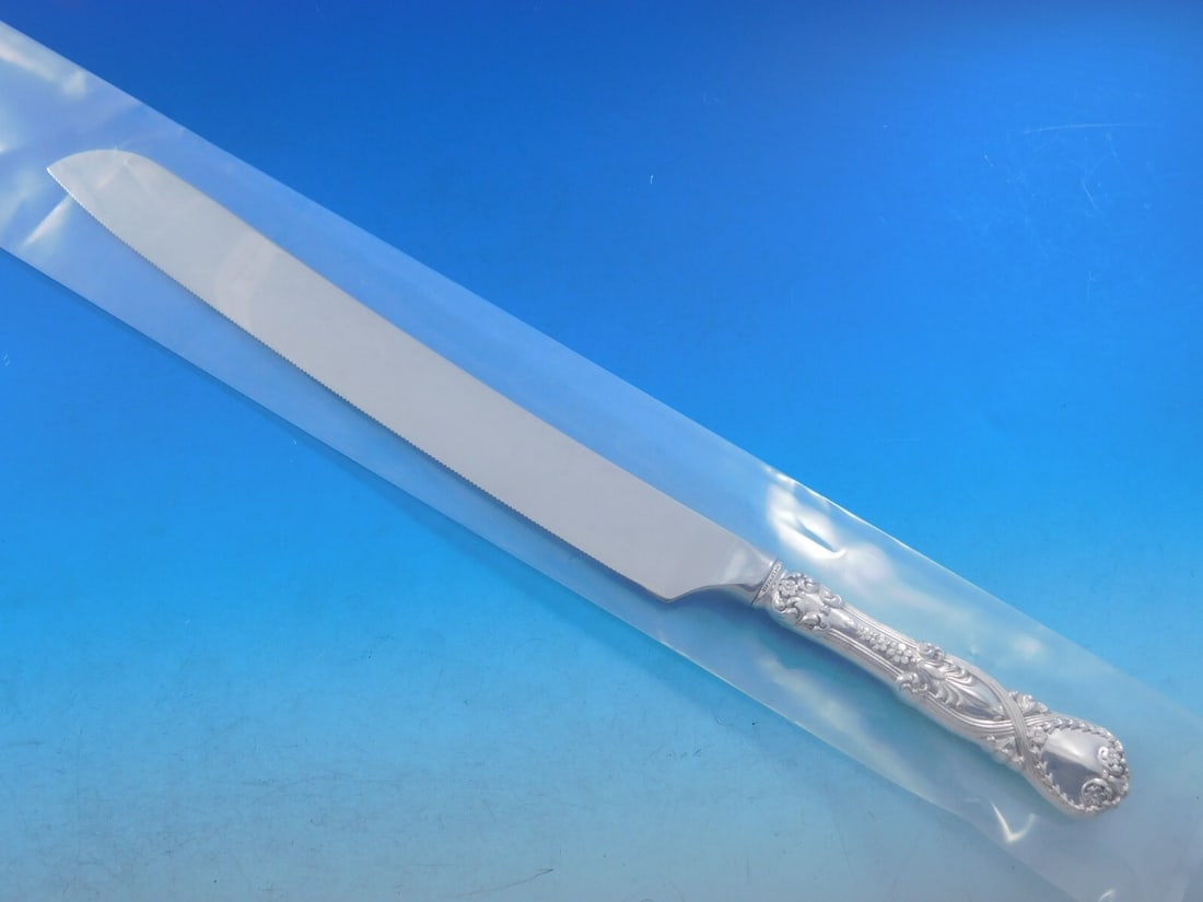 Tiffany & Co. Saint James Sterling Silver Wedding Cake Knife 12": Tiffany & Co. Saint James Sterling Silver Wedding Cake Knife 12" Presenting the exquisite Saint James wedding cake knife by Tiffany & Co., crafted from high-quality sterling silver. This custom-made p