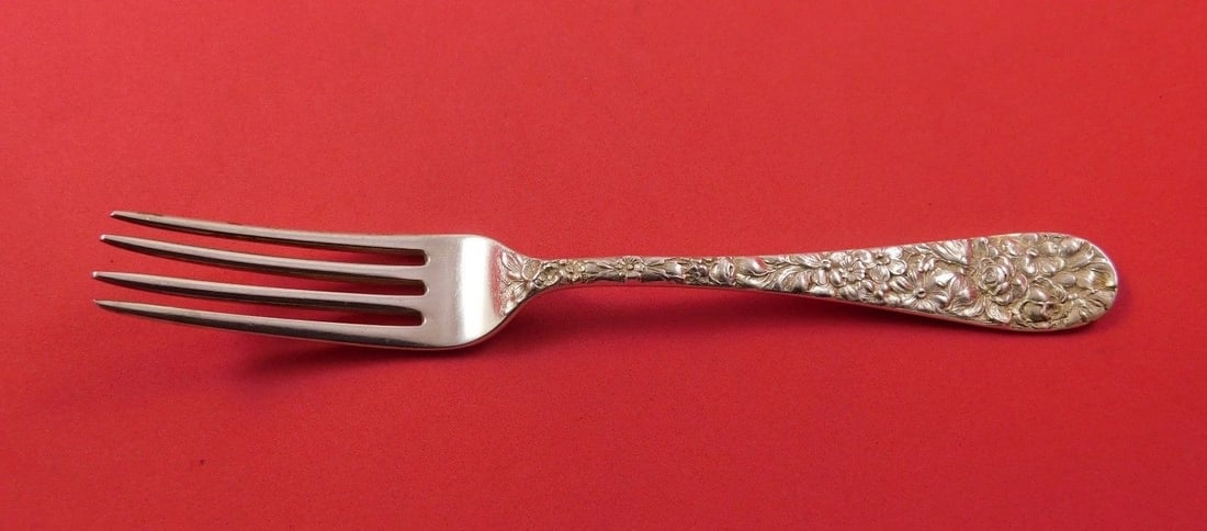 7 inch sterling silver dinner fork in Repousse pattern: 7 inch sterling silver dinner fork in Repousse pattern A sterling silver regular fork with a Repousse pattern by unknown. It is not monogrammed and is in excellent pre-owned condition. The piece was m