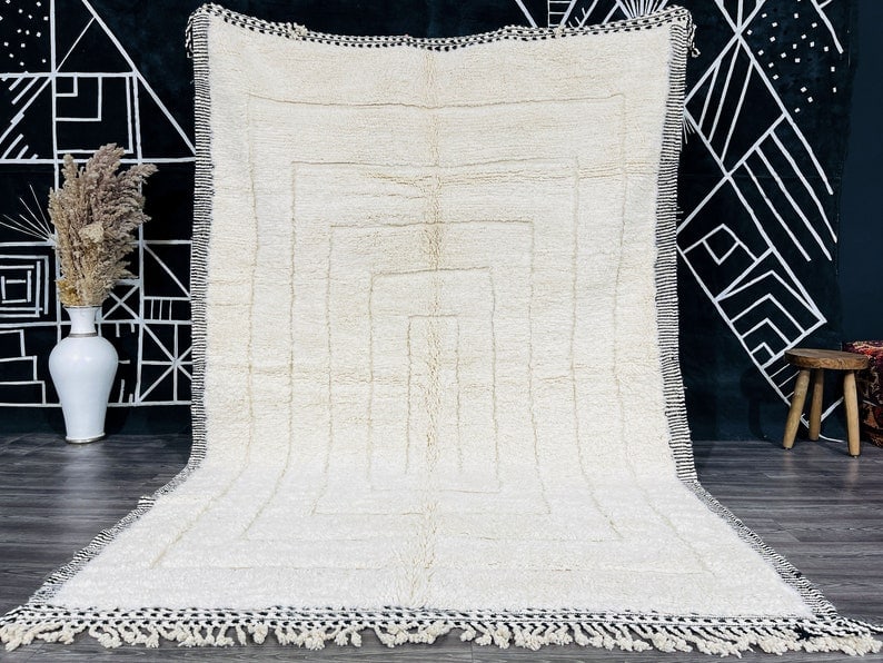 Authentic Handwoven White Engraved Rug from Morocco: Authentic Handwoven White Engraved Rug from Morocco Discover the beauty of an Authentic Elegant White Engraved Rug, meticulously handwoven in the Atlas Mountains by skilled Berber women weavers. Using