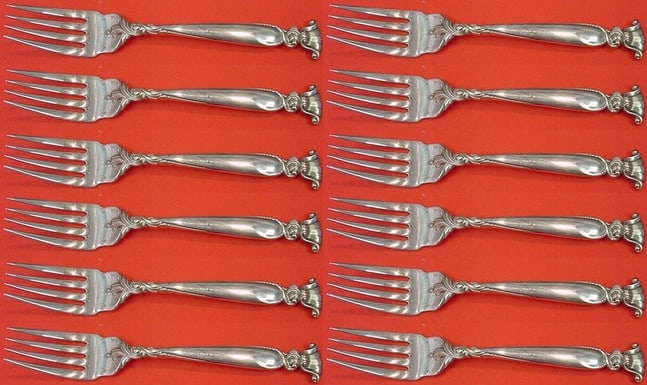 Wallace Romance of the Sea Sterling Silver 12-Pc Salad Fork Set: Wallace Romance of the Sea Sterling Silver 12-Pc Salad Fork Set Enhance your dining experience with this exquisite 12-piece salad fork set from the renowned Wallace collection, featuring the elegant "