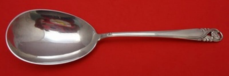 International Sterling Silver Serving Spoon Spring Glory 9 3/8": International Sterling Silver Serving Spoon Spring Glory 9 3/8" This exquisite salad serving spoon features the elegant Spring Glory pattern by International Sterling. Crafted from high-quality sterli