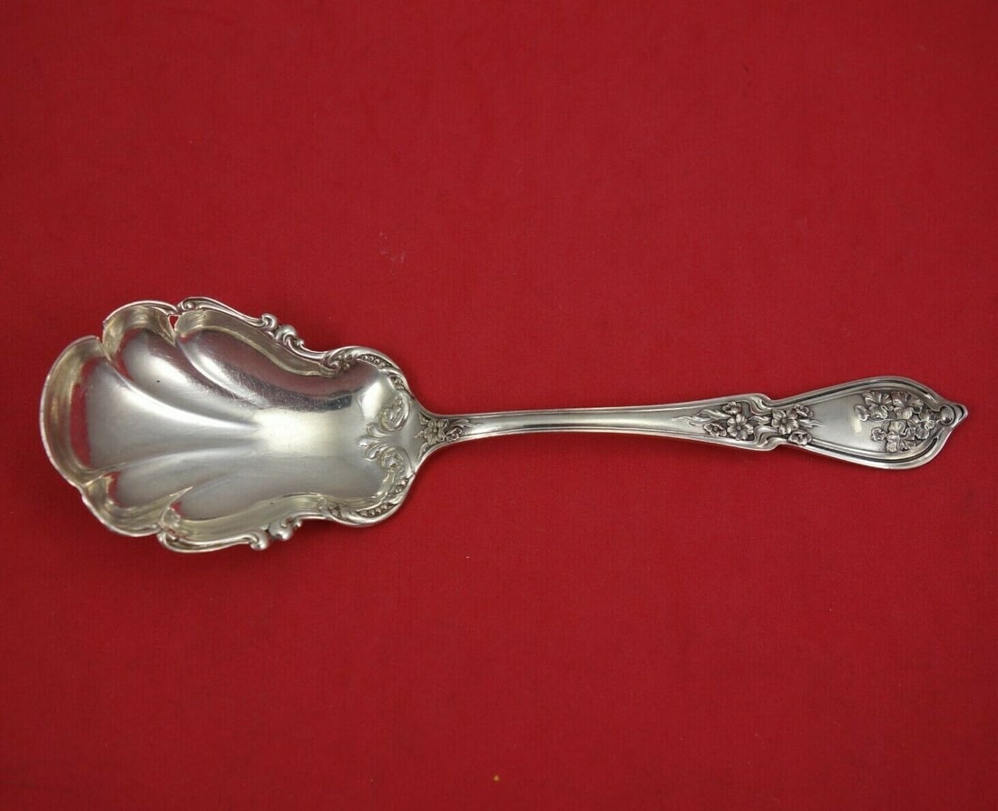 Blackinton Sweetbrier sterling silver fancy preserve serving spoon 7": Blackinton Sweetbrier sterling silver fancy preserve serving spoon 7" Sterling silver preserve spoon in the Sweetbrier pattern by Blackinton. This fancy 7 inch serving piece is not monogrammed and is 