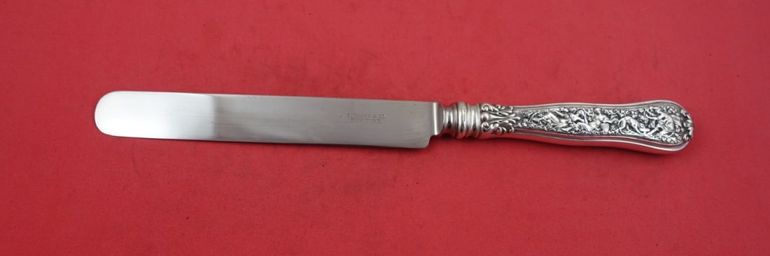 Tiffany & Co Olympian Sterling Silver Banquet Knife 10 3/4" Blunt Blade: Tiffany & Co Olympian Sterling Silver Banquet Knife 10 3/4" Blunt Blade Discover the exquisite craftsmanship of the Olympian pattern by Tiffany & Co. This stunning banquet knife features a blunt silve