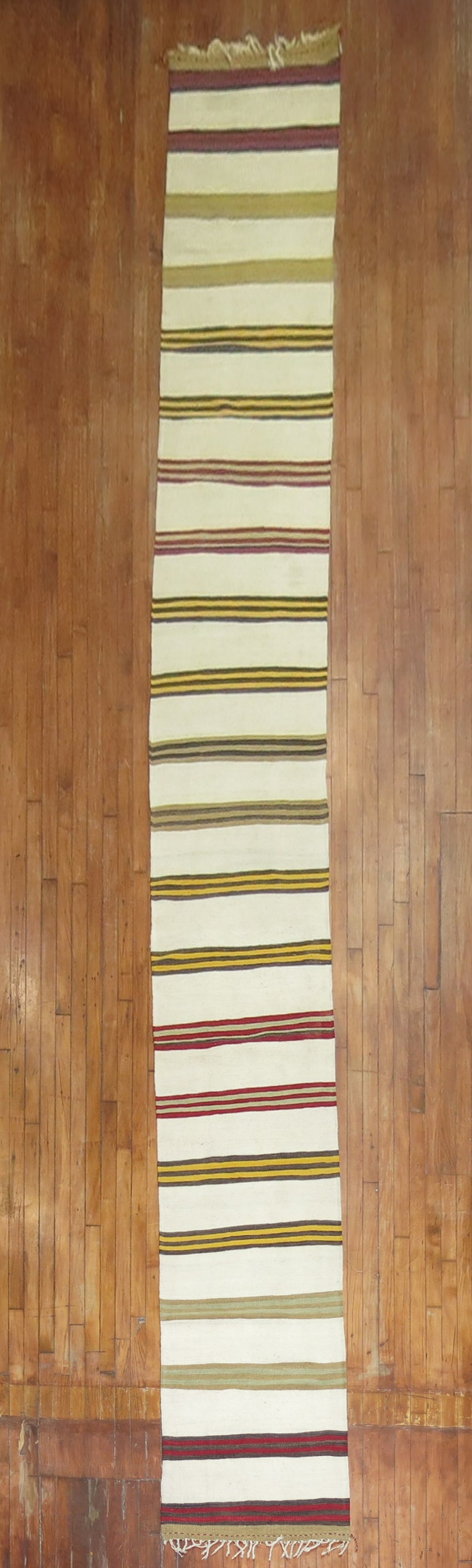 2' 2" x 21' 9" Turkish Kilim Runner Striped Antique: 2' 2" x 21' 9" Turkish Kilim Runner Striped Antique Antique striped Turkish kilim runner from the 2nd quarter of the 20th century. This long runner features a striped design and is offered in pre-owne