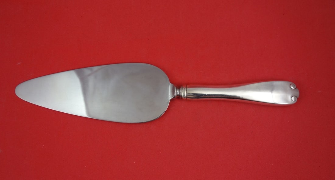 Tiffany Flemish Sterling Hollow Handle Cake Server 10 1 4: Tiffany Flemish Sterling Hollow Handle Cake Server 10 1 4 This pre-owned cake server features the distinguished Flemish pattern by Tiffany & Co. It is crafted with a sterling silver hollow handle and 