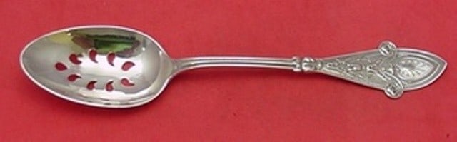 Tiffany & Co Italian Sterling Silver 9-Hole Slotted Serving Spoon 8 3/4": Tiffany & Co Italian Sterling Silver 9-Hole Slotted Serving Spoon 8 3/4" This exquisite serving spoon is a stunning piece from Tiffany & Co., crafted in sterling silver. It features a unique 9-hole de
