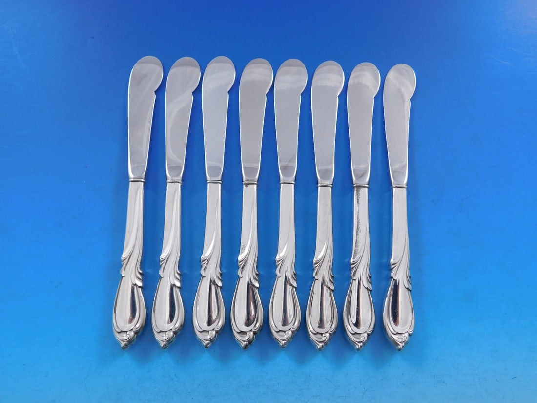 International Sterling Silver Rhapsody New Butter Spreader Set 8 pcs: International Sterling Silver Rhapsody New Butter Spreader Set 8 pcs Enhance your dining experience with this elegant set of 8 butter spreaders from the Rhapsody New pattern by International Sterling.