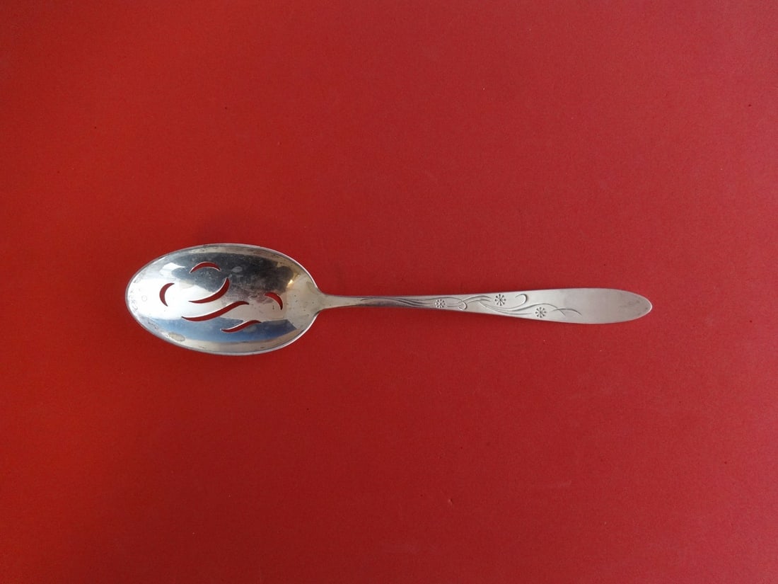 Kirk Cynthia Sterling Silver Slotted Serving Spoon 8.5": Kirk Cynthia Sterling Silver Slotted Serving Spoon 8.5" This exquisite slotted serving spoon from the Cynthia pattern by Kirk is crafted from high-quality sterling silver. Measuring 8 1/2 inches, it s